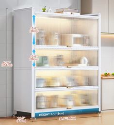 a white cabinet filled with lots of shelves next to a counter top oven and microwave