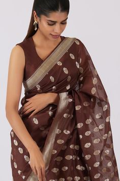 Chocolate brown saree with zari floral motifs. Comes with unstitched blouse piece.
Components: 2
Type Of Work: Floral
Fabric: Silk Organza
Color: Brown
Other Details: 
Border detailing
Note: The stitched blouse worn by the model is not for sale
Occasion: Puja - Aza Fashions Diwali Chanderi Pre-draped Saree With Unstitched Blouse, Festive Cotton Silk Pre-draped Saree For Celebration, Festive Georgette Blouse With Zari Weaving, Navratri Celebration Blouse With Sheer Dupatta, Semi-stitched Cotton Silk Pre-draped Saree For Celebration, Banarasi Silk Pre-draped Saree For Diwali Celebration, Festive Celebration Blouse With Sheer Dupatta, Transitional Celebration Semi-stitched Pre-draped Saree, Transitional Festive Pre-draped Saree With Self Design