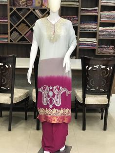 A stunningly marvelous outfit. This outfit features kashmir tilla and aari fusion embroidery on the front neckline and ghera (hemline) of the shirt. The dupatta features 4-sided embroidered border with big embroidered paisleys design in the middle. The shirt and dupatta feature Banarsi Brocade taping.- - - - - - - - - - - - - - - - - - - - Product DetailsCondition: Brand NewF A B R I CShirt: Viscose GeorgetteDupatta: Viscose GeorgetteLower: Indian CrepeColor: Grey-Pink Double Shaded*Kindly note Anarkali Palazzo Set With Intricate Embroidery, Designer Georgette Palazzo Set With Intricate Embroidery, Designer Anarkali Set With Intricate Embroidery, Transitional Straight Kurta Palazzo Set With Intricate Embroidery, Designer Raw Silk Sets With Dabka Work, Unstitched Palazzo Set With Resham Embroidery And Straight Kurta, Anarkali Raw Silk Palazzo Set With Intricate Embroidery, Designer Anarkali Sets In Chinon, Straight Kurta Sets With Resham Embroidery In Chinon