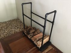 a stack of wood sitting on top of a wooden floor next to a pile of logs