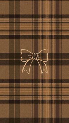 a brown and black plaid pattern with a large bow on it's back side