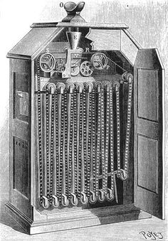 an old fashioned machine with many keys on the front and side, in black and white