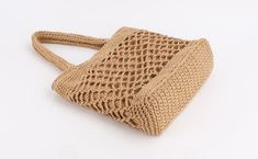 Shape: Casual ToteHandbags Type: Shoulder BagsTypes of bags: Shoulder & HandbagsOrigin: CN(Origin)Main Material: StrawClosure Type: OPENHardness: SOFTExterior: NONEStyle: BohemianLining Material: PolyesterOccasion: partyGender: WOMENPattern Type: KnittingNumber of Handles/Straps: TwoInterior: Cell Phone PocketDecoration: Hollow OutItem Type: HandbagsStraw Bag: Bag for WomenShoulder Bag: Women Shoulder BagsWomen Bag: Summer Travel Bag Light Brown Rectangular Hobo Bag With Large Capacity, Beige Rectangular Shoulder Bag For Shopping, Light Brown Large Capacity Rectangular Hobo Bag, Square Beige Shoulder Bag For Shopping, Beige Square Shoulder Bag For Shopping, Large Capacity Camel Shoulder Bag, Eco-friendly Beige Satchel Bag, Beige Square Shopping Bag, Large Capacity Light Brown Rectangular Beach Bag