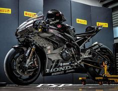 a motorcycle is being worked on by a mechanic