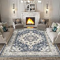 a living room filled with furniture and a fire place in the middle of the room