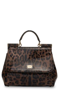 Signature Dolce&Gabbana panache and modern aesthetics merge on this leopard-print coated calf hair handbag from the Kim Kardashian runway collection. Magnetic-snap flap closure Top carry handle; removable, adjustable shoulder strap Interior zip and wall pockets Structured silhouette with flat base and protective metal feet Leather lining Genuine calf hair (China) Made in Italy Designer Handbags Top Handle Bags In Leopard Print, Leopard Print Bag With Double Top Carry Handle, Leopard Print Leather Top Handle Bag, Leopard Print Top Handle Bag With Removable Pouch, Leopard Print Bags With Detachable Handle For Travel, Leopard Print Top Handle Bag For Travel, Tortoiseshell Bags For Everyday Use, Elegant Evening Bags In Tortoiseshell, Leopard Print Travel Bag With Detachable Handle