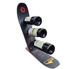 a snowboard with two wine bottles attached to it