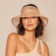 Practical and chic, the Kayla bucket visor will become a must-have when packing for those sun-soaked vacations. It's woven from camel sinamay with a transparent finish for that airy chicness. Finished with a satin band on the inside to lay soft on your locks. Measurements: HEADSIZE: 6.75" / CROWN: 2.75" / BRIM: 4.50" / CIRCUMFERENCE: 22.5"PackableAdjustable Grosgrain Ribbon for SizeSpot cleanImported Eugenia Kim, Summer Hats, Grosgrain Ribbon, Camel, How To Become, Ribbon, Crown, Satin, Sun