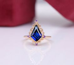 BeckyB Jewelry offers fine jewelry in solid gold and gold-plated 925 sterling silver Metal type - 925 sterling silver Main Gemstone  - Lab Created Blue Sapphire Gemstone Shape:- Kite Gemstone Size:- 12X8 mm Gemstone Wt - 2.75 Carats Stamp - 925/14K/18K Amethyst Accents Plating - 14k rose gold vermeil Realization - Typical Handmade Occasions - engagement, wedding, birthday, anniversary, Easter gift, etc. We can make this particular ring with all types of semiprecious and precious gemstones [as pe Elegant Marquise Amethyst Ring As A Gift, Gold Amethyst Ring With Sapphire For Anniversary, Amethyst Marquise Ring For Gift, Blue Amethyst Ring Fine Jewelry For Gift, Blue Amethyst Ring Fine Jewelry Gift, Hallmarked Sapphire Birthstone Ring Gift, Fine Jewelry Marquise Topaz Ring, Marquise Topaz Ring Fine Jewelry Gift, 14k Rose Gold Amethyst Ring As A Gift