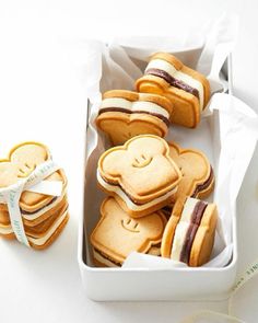 some cookies are in a white box on a table