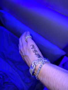 a person's arm with two bracelets on it