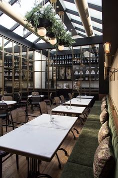 an empty restaurant with many tables and chairs