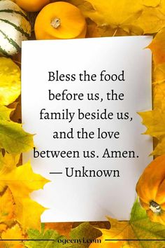 a piece of paper sitting on top of leaves with a quote about food before us, the family beside us, and the love between us amen - unknown