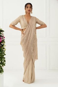 Shop for Nidhika Shekhar Beige Crepe Sequin Pre-draped Saree With Blouse for Women Online at Aza Fashions Plunging Neckline Blouse, Draped Saree Gown, Draped Saree, Corset Blouse, Ruffle Saree, Saree Gown, Drape Saree, Embroidered Neckline, Blouse For Women