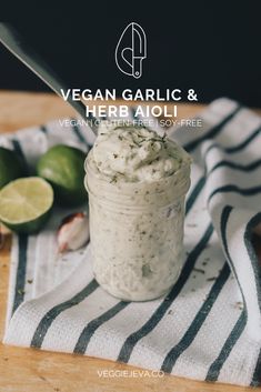 vegan garlic and herb aioli in a jar with limes on the side