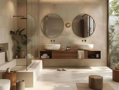 a bathroom with two sinks and mirrors on the wall, along with a large window