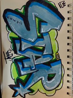 a spiral notebook with graffiti written on the cover and in blue, green, and yellow colors