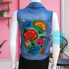 "Mexican floral embroidered vest. Made out of a soft, durable denim, with comfortable stretch. Decorative button-flap faux pockets at chest. Side welt pockets in front. Size- Small Measurements: Bust- 33\" Length- 20\" 🧺Care Instructions: We recommend hand washing separately, hang to dry. 📸Additional photos can be provided upon request. 👗Always allow a little room and consider your own measurements before purchase to avoid any problems. If measurement are exact chances are the garments will b Blue Embroidered Denim Vest, Casual Denim Vest With Floral Embroidery For Spring, Casual Floral Embroidered Denim Vest For Spring, Summer Embroidered Blue Denim Vest, Embroidered Blue Denim Vest For Summer, Blue Embroidered Denim Vest For Summer, Summer Cotton Denim Vest With Floral Embroidery, Summer Embroidered Denim Vest, Casual Embroidered Denim Vest For Summer