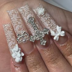 ˚୨୧₊♱ inspo @nailfairyjas #coquette #coquettenails #whitenails #junknails #lacenails #y2knails #dmvnails #dmvnailtech #nailinspo | Instagram White Coquette Nails, Nails Acrylic With Cross Charm, Acrylics With Cross Charm, Lace French Tip Nails, Cute Prom Nails, Long Nails With Cross Charm, Oldies Nails, Emo Coquette Nails, Nails Lace