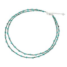 This necklace by Somluck Komolmith features two narrow strands of gemstones in exotic shades of blue that flow gracefully around the neck. Calcite and reconstituted turquoise mingle with beads of faceted pyrite. The necklace fastens with a sterling silver clasp. Reconstituted turquoise, dyed calcite, pyrite, sterling silver clasp Spring ring clasp Handmade in & fairly traded from Thailand Turquoise Gemstone Multi-strand Necklace, Turquoise Multi-strand Gemstone Necklace, Turquoise Multi-strand Gemstone Necklaces, Adjustable Faceted Turquoise Necklace, Adjustable Faceted Turquoise Beaded Necklaces, Bohemian Faceted Turquoise Necklaces, Faceted Turquoise Bohemian Necklaces, Blue Multi-strand Gemstone Beaded Necklace, Bohemian Faceted Turquoise Beaded Necklaces