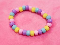 Handmade kandi bracelet that is in all pastel colors! Bracelet is stretchy :) Inner circumference: 6.5 inches Pastel Kandi, Bracelets Kandi, Diy Kandi Bracelets, Pony Bead Bracelets, Diy Kandi, Kandi Ideas, Kandi Bracelets, Kandy, Bracelet Ideas