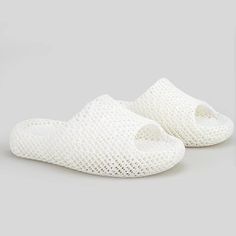 Our 3D Printing Sport Repair Slippers for Men and Women, designed to provide optimal comfort and recovery after various physical activities. These slippers are available in sizes ranging from 36 EU to 45 EU and come in three stylish colors: black and white for men, and white and pink for women. Made from environmentally friendly elastomer material, these slippers are breathable and skin-friendly, ensuring maximum comfort. The biomimetic lattice design gives the sensation of "stepping on feces," providing unparalleled cushioning and support. These slippers are perfect for post-running, playing ball, fitness, yoga, and other activities, effectively relieving soreness and combating fatigue. Crafted using ultra-high-speed light curing 3D printing technology, these slippers boast cutting-edge f White Breathable Slip-on Slides, Lightweight Breathable Slides For Comfort, Comfortable Lightweight Breathable Slides, White Slip-resistant Casual Slippers, Casual White Slip-resistant Slippers, Sporty White Non-slip Slippers, Sports Recovery, Colors Black And White, Slippers For Men