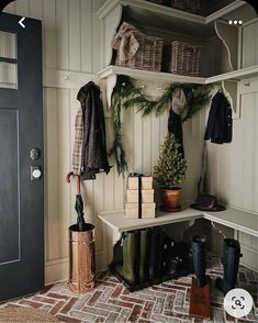 a coat rack with umbrellas, boots and books