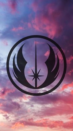 the star wars symbol is silhouetted against a purple and blue sky