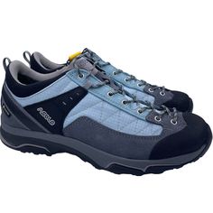 a pair of blue and grey shoes with laces on the outstep, side view