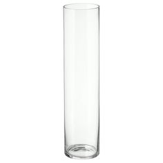 a tall glass vase sitting on top of a table