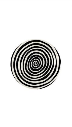 a black and white circular object on a white background