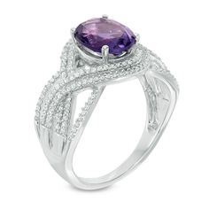 Make her February birthday extra-special with this striking gemstone fashion ring. Created in sleek 10K white gold, this modern style showcases a 9.0 x 7.0mm oval-shaped bright purple amethyst center stone. Double ribbons of sparkling diamonds swirl around the center stone, creating a fluid-looking split shank. Designed to be treasured, this ring captivates with 1/3 ct. t.w. of diamonds and a brilliant buffed luster. Modern Amethyst Ring With Accent Stones For Formal Occasions, Modern Amethyst Ring With Accent Stones For Formal Events, Elegant 14k White Gold Amethyst Ring With Center Stone, Modern Amethyst Anniversary Ring, Elegant Purple Platinum Rings, Elegant White Gold Amethyst Ring With Polished Finish, Modern Amethyst Ring With Center Stone For Formal Occasions, Modern White Gold Amethyst Ring, Elegant 14k White Gold Purple Ring