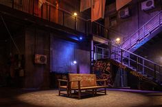 a wooden bench sitting on top of a stage