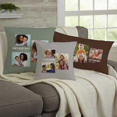 a couch with two pillows on it and some pictures hanging from the back of each pillow