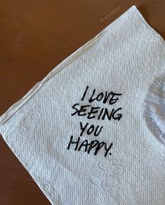 a napkin with the words i love seeing you happy written on it