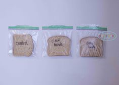 three pieces of bread in plastic bags with words written on the front and back of them