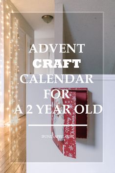 an advertisement for a holiday craft calendar with lights on the wall and a red mailbox