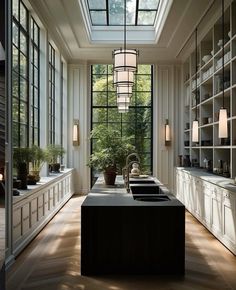 a kitchen with lots of windows and cabinets