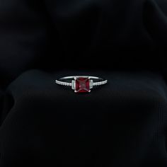 Product Details Add a little sparkle to her ensemble with our Ruby Engagement Ring, timeless jewelry for your special day. Embellished with a princess-cut created ruby claw set in the center and the diamond-lined shank captures attention. Embrace her wedding look with this created ruby ring, a perfect combination of elegance and sophistication. Impress her with the mesmerizing red allure of this ruby ring and leave a lasting impression on her heart. Product Information SKU SHP-RINGS032012640 Wid Formal Birthstone Ring With Radiant Cut Center Stone, Formal Radiant Cut Birthstone Ring With Center Stone, Fine Jewelry Ruby With Radiant Cut, Elegant Radiant Cut Birthstone Ring For Wedding, Elegant Radiant Cut Birthstone Wedding Ring, Formal Jewelry With Princess Cut Accent Stones, Red Baguette Cut Diamond Accent Jewelry, Lab-created Ruby Ring With Diamond Accents As Gift, Radiant Cut Gemstone Birthstone Ring For Formal Occasions