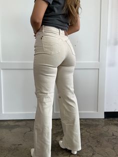 Step up your denim game with More To Come High Waist Distressed Wide Leg Jeans. With a flattering high waisted fit, these bone colored jeans feature a distressed design for a touch of edge. Zip fly closure, functional pockets, and belt loops add convenience to the stylish wide leg silhouette. Made with soft and comfortable material, these jeans are perfect for any casual or dressy occasion. More to come indeed! DETAILS Brand: Judy Blue Bone wide leg jeans High waisted fit Distressed design Zip f Beige Denim Flare Jeans For Fall, Trendy Wide Leg Neutral Jeans, Trendy Beige Wide Leg Jeans, Trendy Beige Fall Jeans, Mid-rise Beige Denim Flare Jeans, Beige Relaxed Fit Flare Jeans, Beige Relaxed Fit Flare Jeans For Spring, Cream Straight Leg Jeans For Fall, Beige Mid-rise Flare Jeans