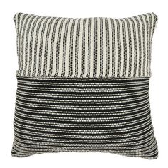 a black and white striped pillow on a white background