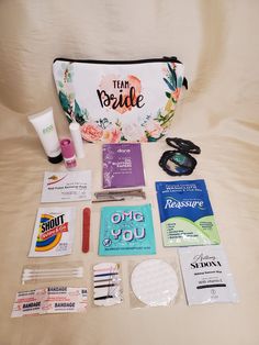 the contents of a travel bag laid out on a bed