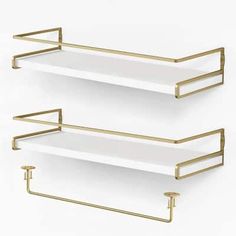 two white shelves with gold handles on each shelf