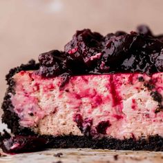 a piece of cheesecake with blueberry topping on top