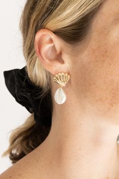 Crafted with care, these earrings feature delicate seashells and authentic puka shells dangling gracefully from each ear. Inspired by the serene allure of the ocean, they infuse your ensemble with a touch of seaside elegance. Perfect for adding a hint of beachy flair to any outfit, whether you're vacationing by the shore or simply longing for coastal vibes. Product Details: Width: 1" Length: 1.5" Earring back: Post Metal finish: gold, rhodium Plated Product: Lead & Nickel Compliant Anti-tarnish: Shell Wedding, Post Metal, Coastal Vibes, Puka Shell, Beauty Sale, Shell Earrings, Earring Backs, Vintage Shoes, Clothes Gift