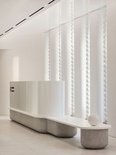 an empty room with white walls and columns