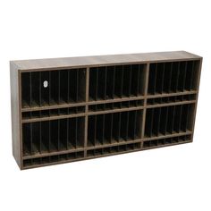 a large wooden shelf with several bins on each side and two holes in the middle