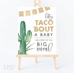 a sign that says it's taco bout, a baby welcome to the big reveal