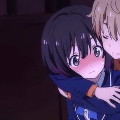 two anime characters hugging each other in the dark