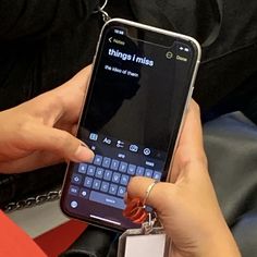 a person holding a cell phone in their hand with the text things i miss on it